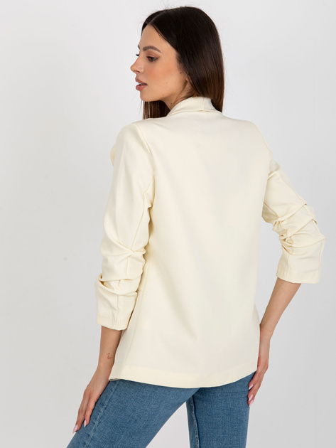 Hurtownia Jasnobeżowa marynarka z kwiatem OCH BELLA