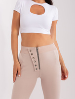 Hurt Beżowe damskie spodnie dresowe z guzikami 