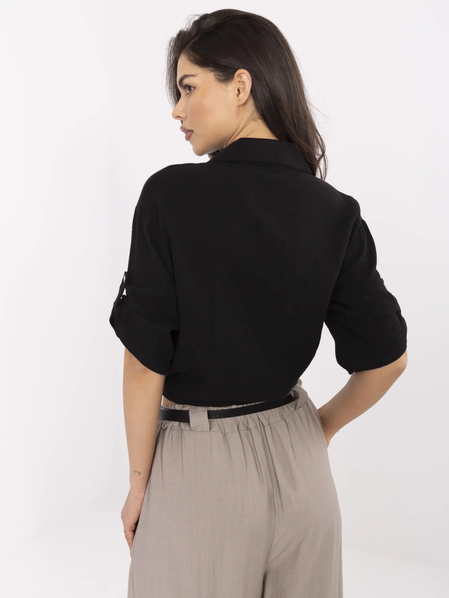 Black muslin shirt with a tie.