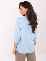 Light blue women's cotton blouse.
