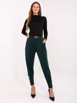 Dunkelgrüne Sweatpants mit langen Bündchen.