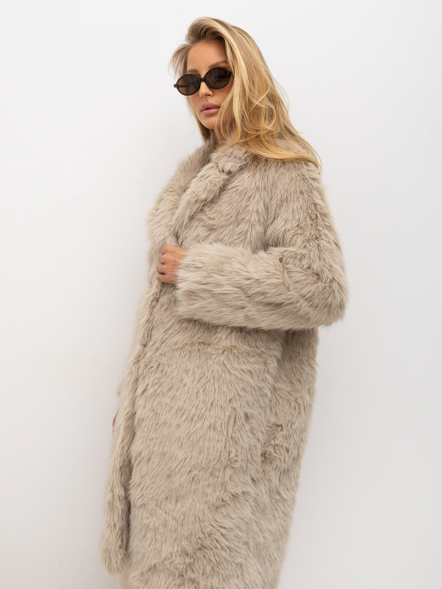 Beige women's fur with long hair.