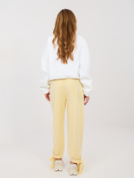 Jasnożółte dresowe spodnie z kieszeniami 