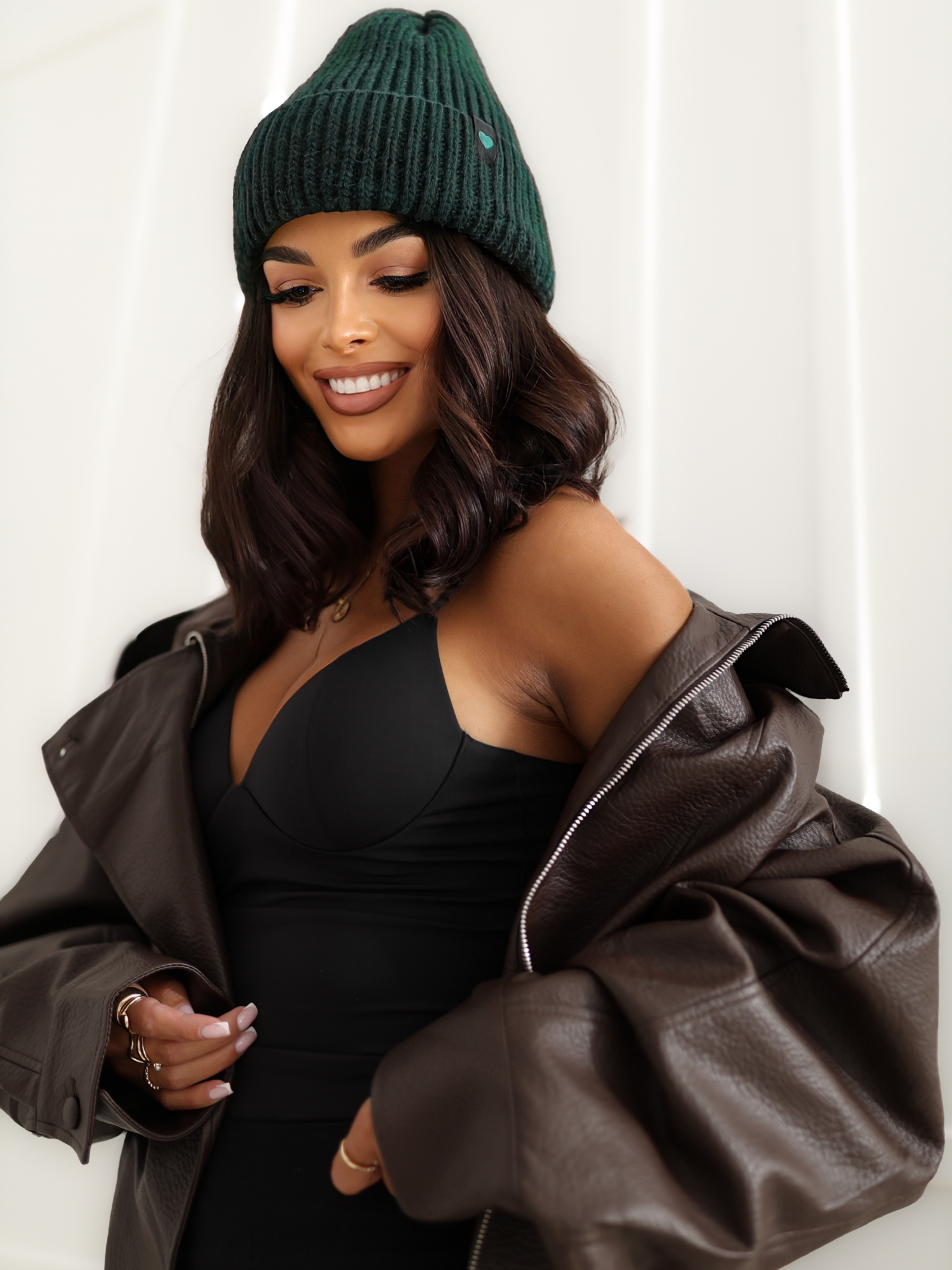 Dark green ribbed winter beanie hat.