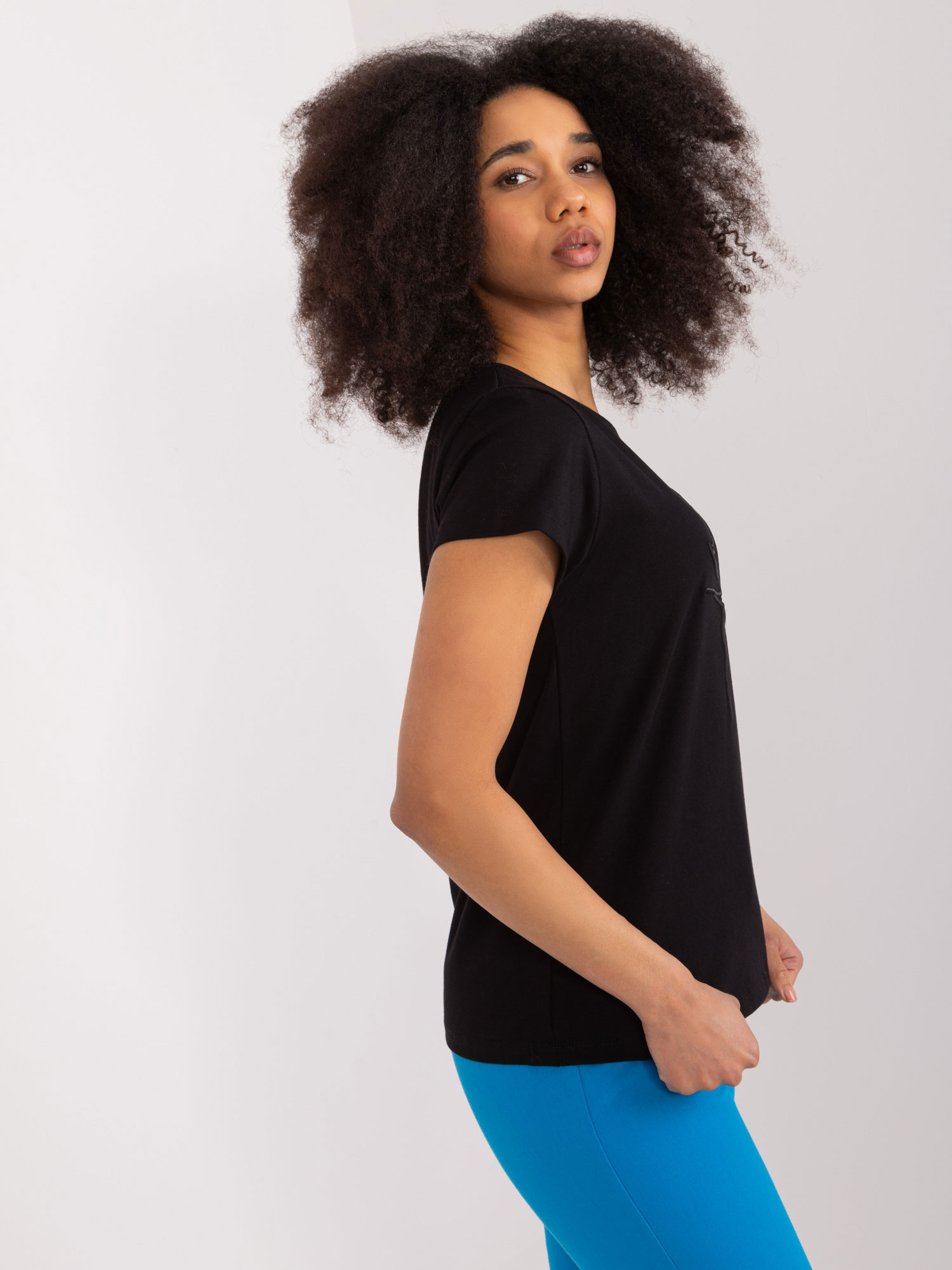 Wholesale Black T-shirt with BASIC FEEL GOOD appliqué.