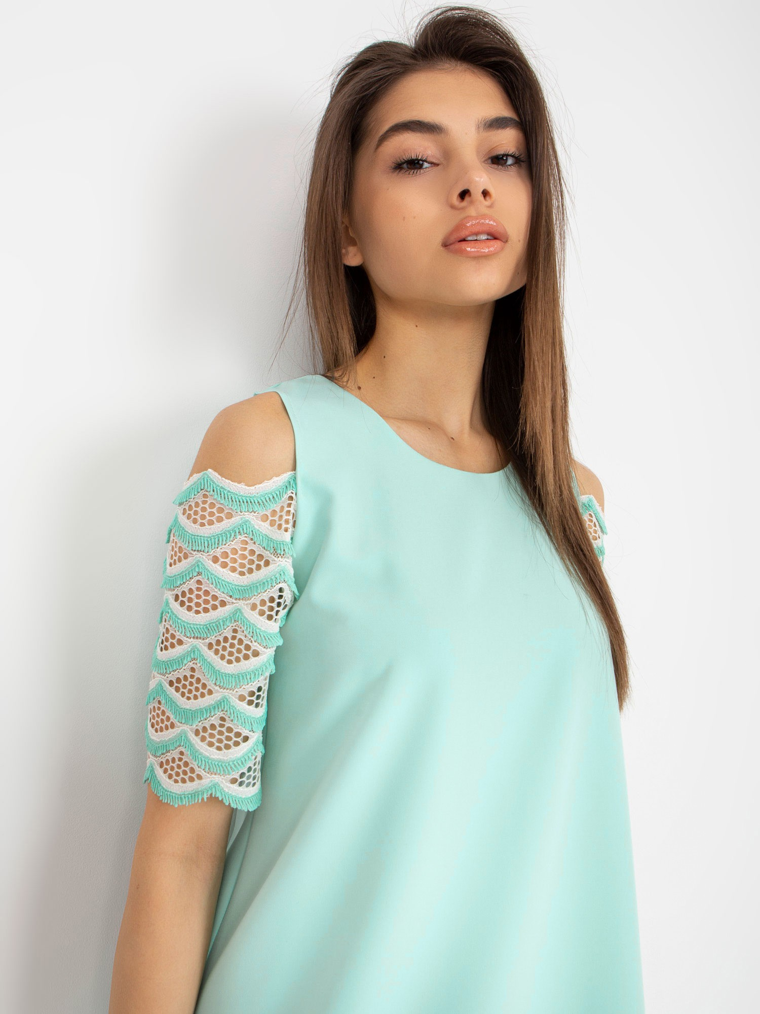 Hurt Mint cocktail dress with off-the-shoulder sleeves.