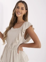 Beige muslin jumpsuit with an elastic waistband.