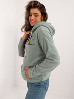 Hurtownia Pistacjowa damska bluza kangurka z nadrukami SUBLEVEL