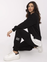 Black tracksuit set with a hoodless sweatshirt.