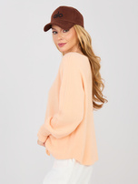 Pastellorange Pullover mit Alpakawolle.