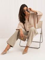 Beige women's cardigan in Asian style.