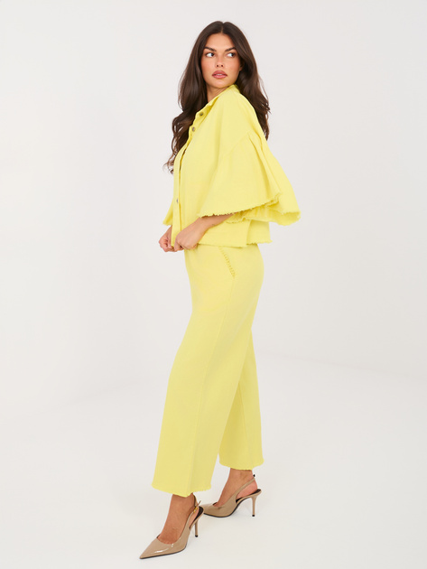 Jasnożółte damskie jeansy z ozdobnymi pomponami