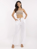 White summer pants with a woven belt.