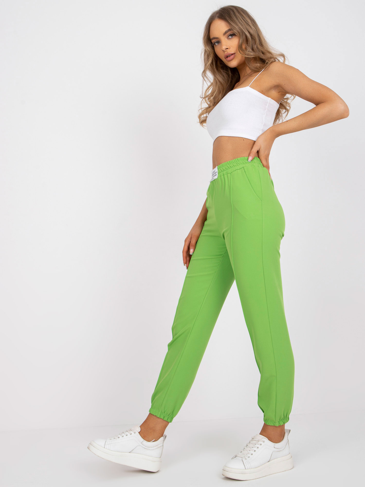 Light green women's pants made of fabric without fastening.
