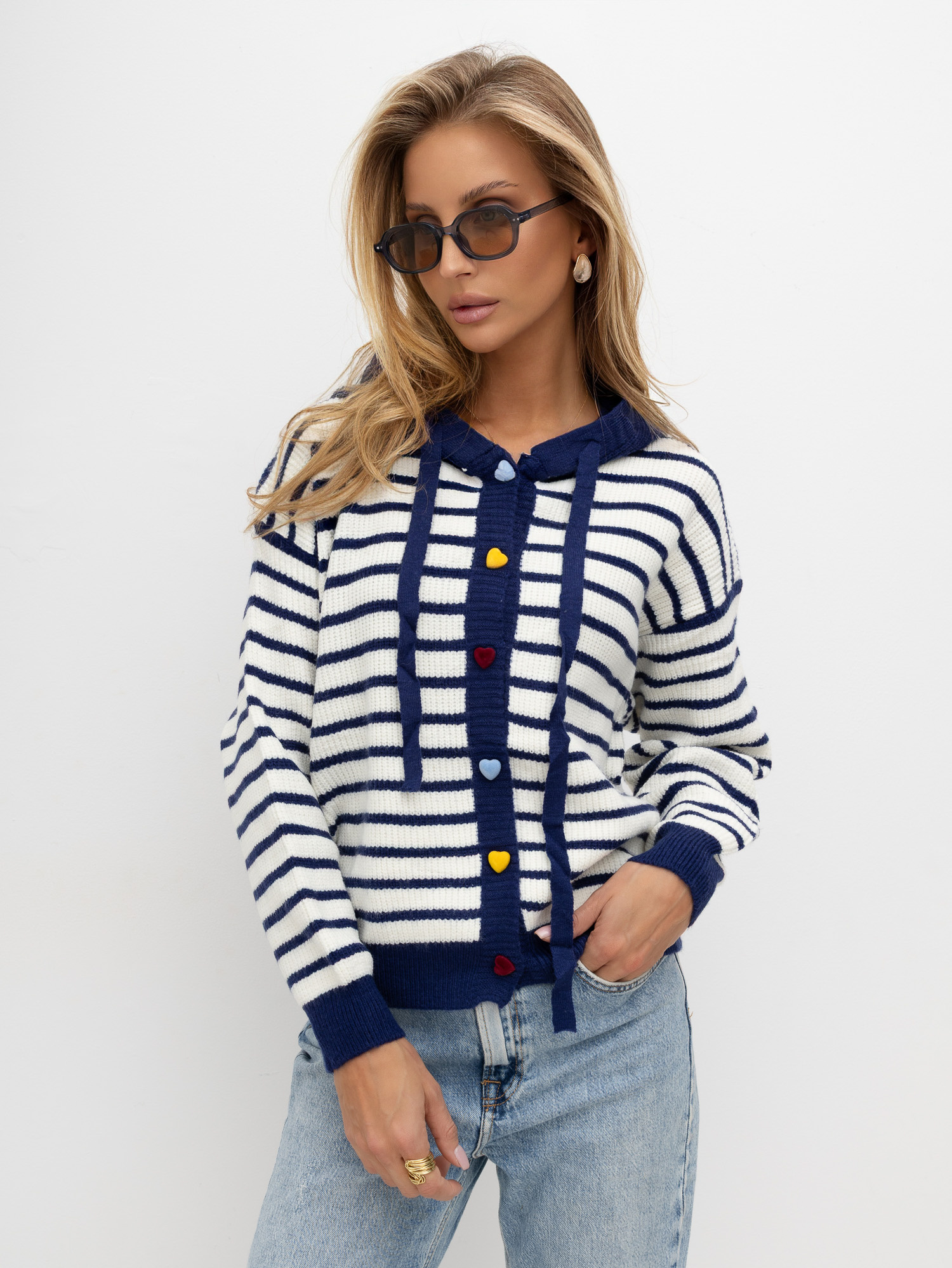 Navy sweater with decorative heart-shaped buttons.