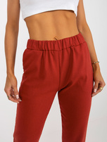 Hurt Ciemnopomarańczowe wełniane spodnie z materiału od garnituru