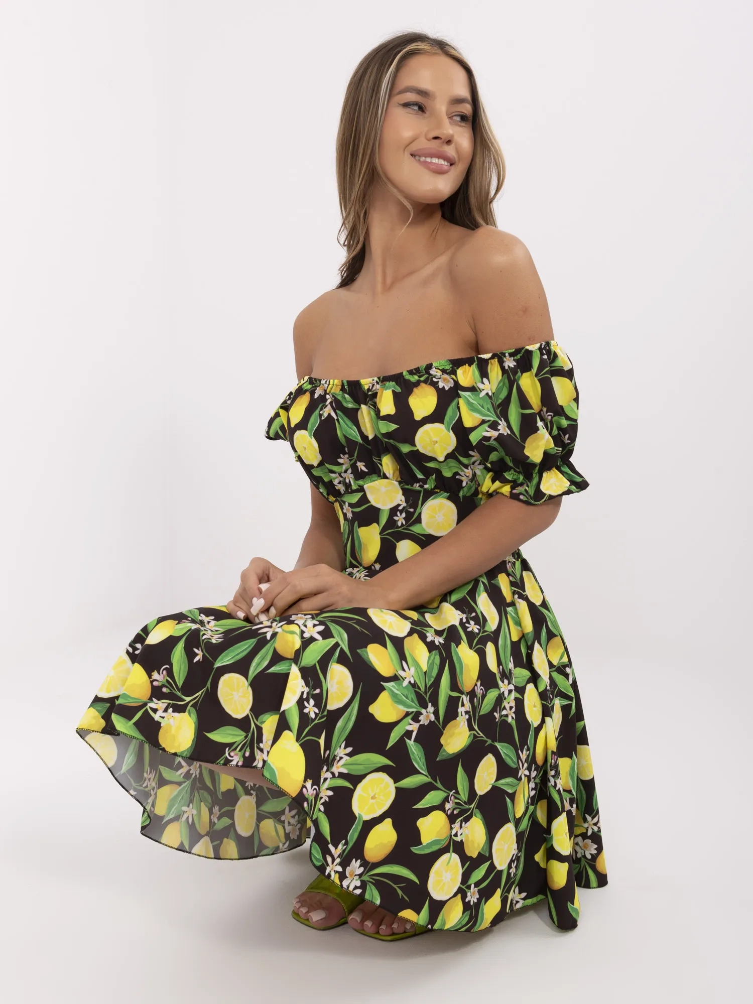 Black-yellow flared off-the-shoulder dress.