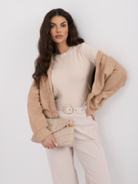 Beige women's sweater with buttons on the sleeves.