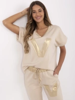 Beżowy casualowy komplet ze złotymi wstawkami