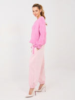 Jasnoróżowe dresowe spodnie ze ściągaczami