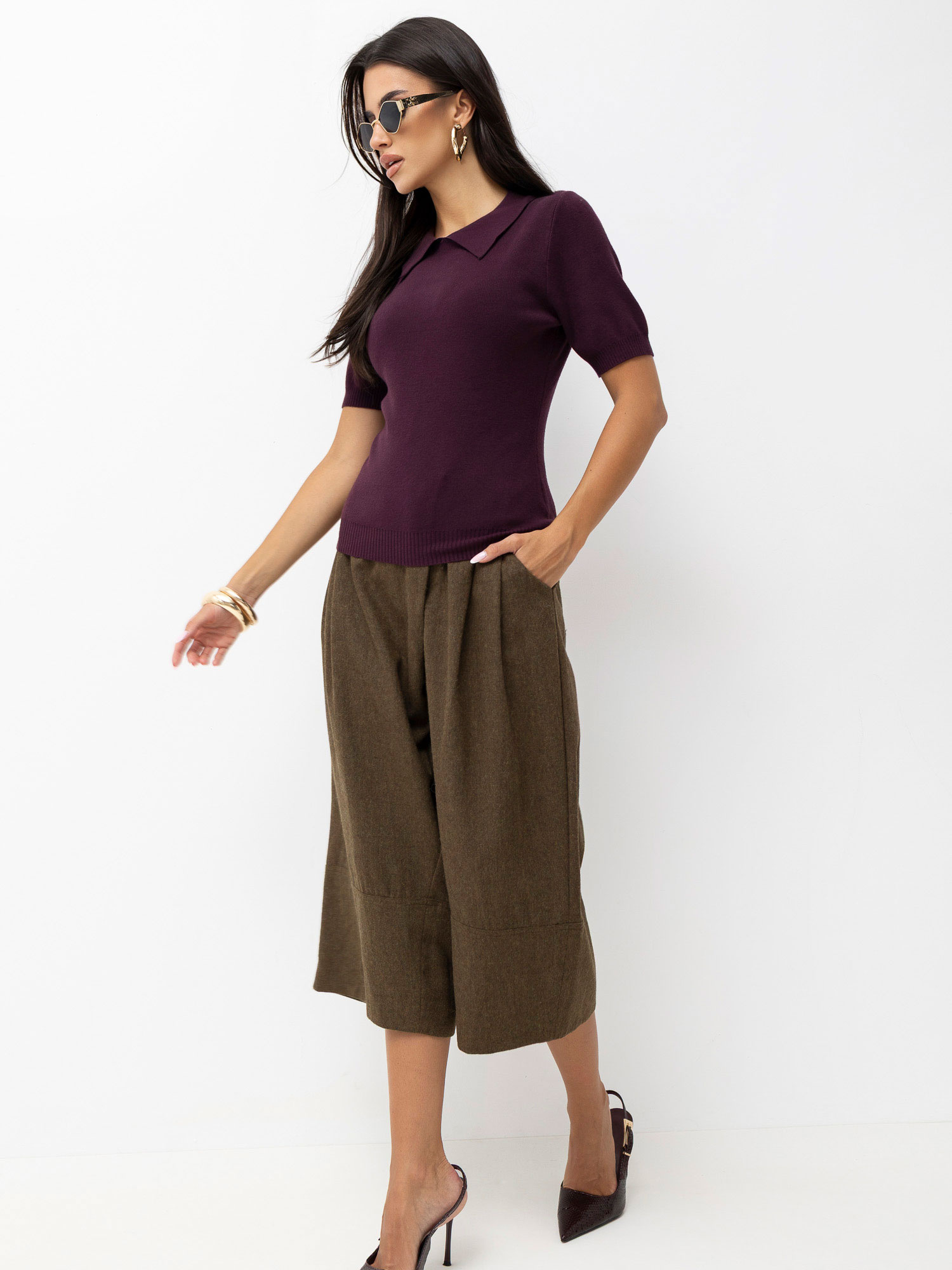 Dark purple polo sweater with ribbed cuffs.