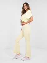 Pastelowe żółte dresowe spodnie typu dzwony RUE PARIS