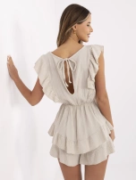 Beżowy muślinowy kombinezon z gumką w pasie