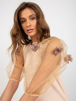 Peach-camel cocktail dress with short sleeves.