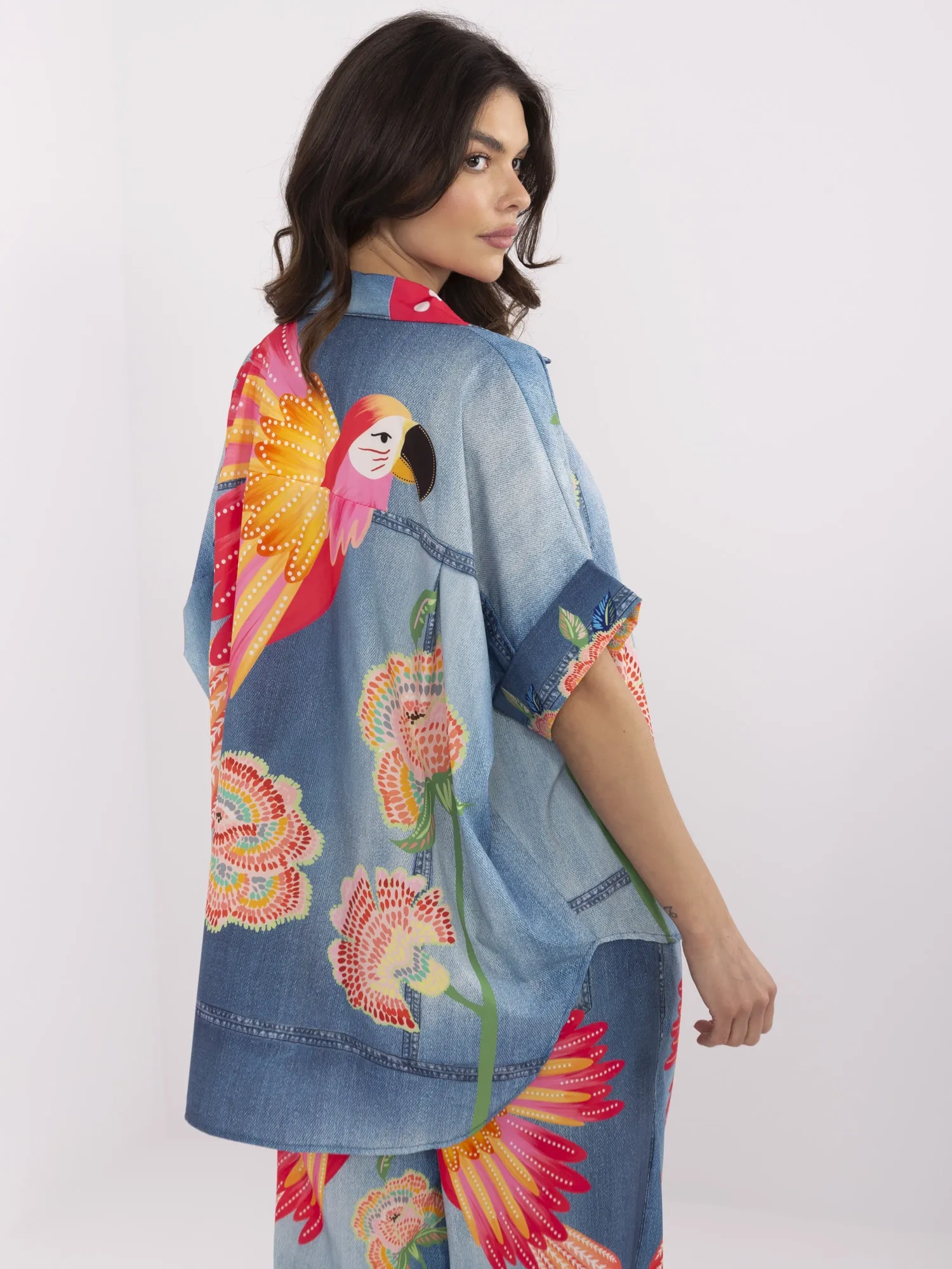 Blue women's shirt with colorful print.