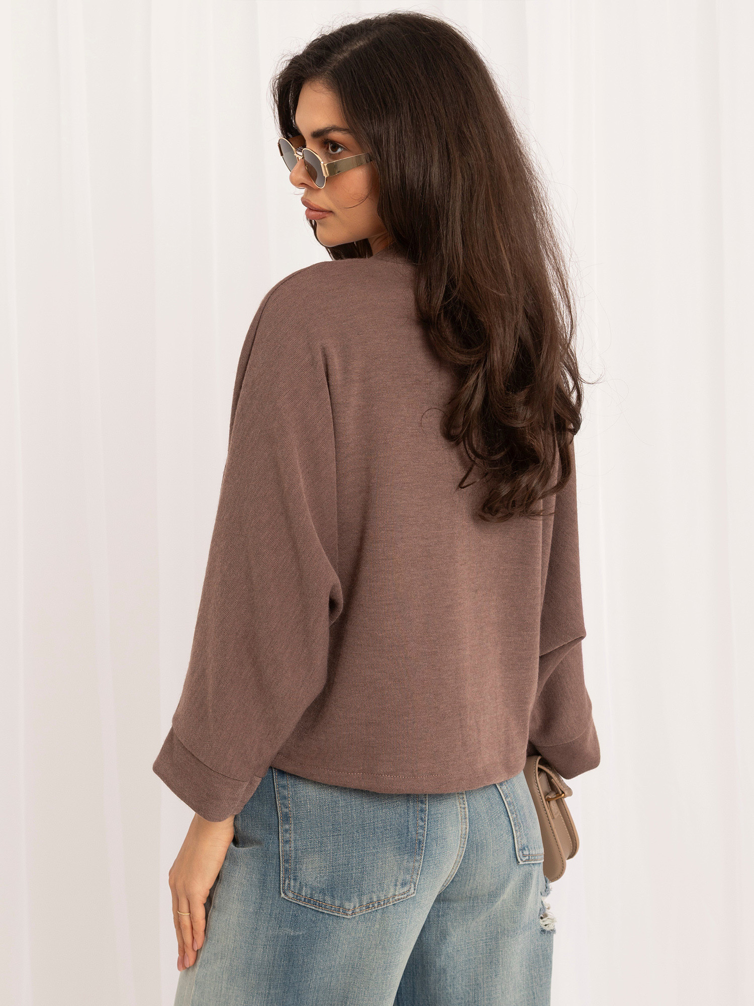Dark beige batwing sweater with mandarin closure.