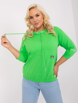 Hurtownia Jasnozielona damska bluzka plus size ze ściągaczem