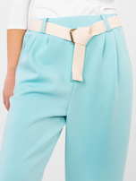 Miętowe dresowe spodnie z kieszeniami 