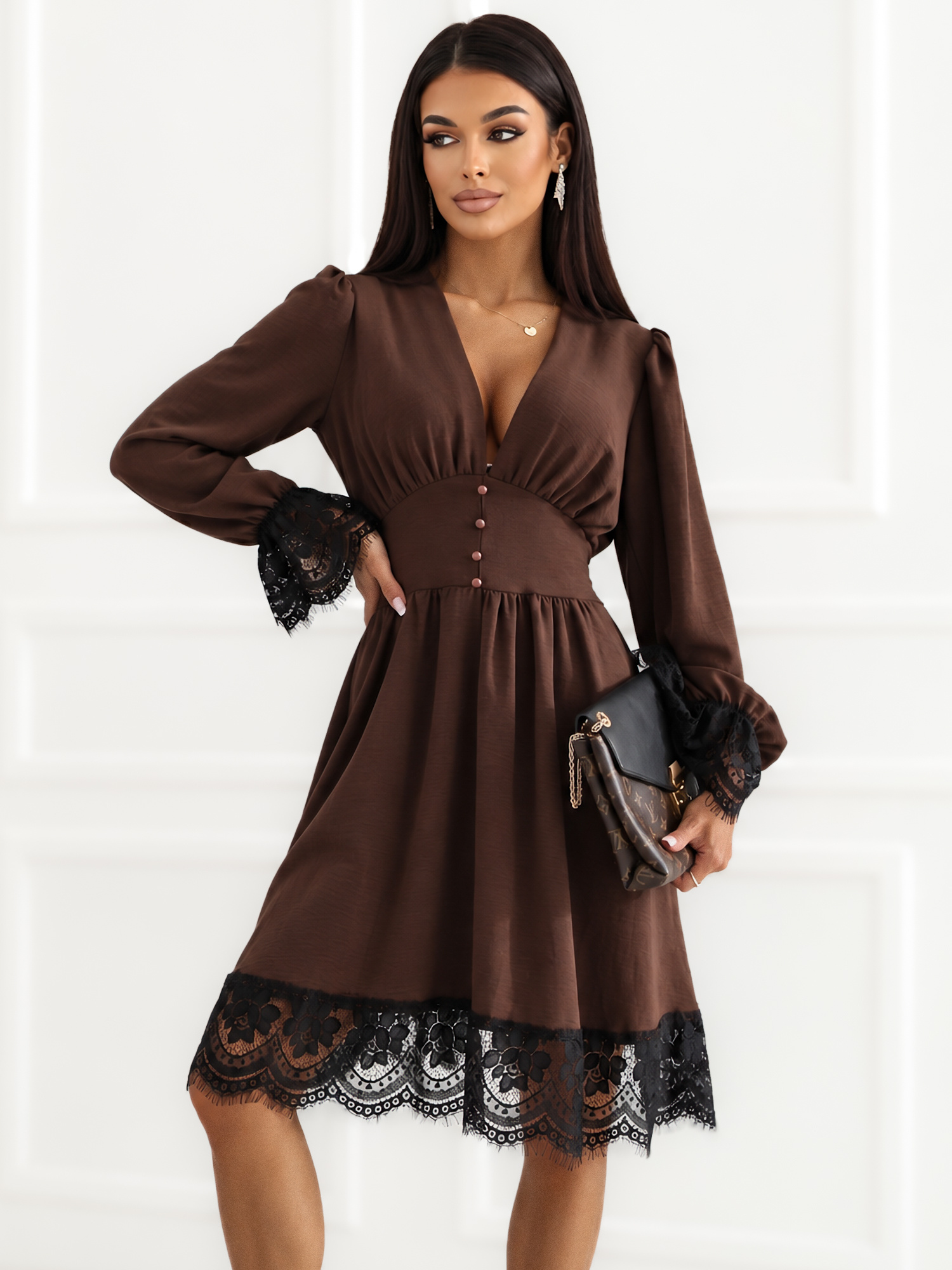 Brown dress with lace trim.