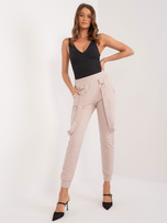 Hurt Beżowe spodnie dresowe z kieszeniami