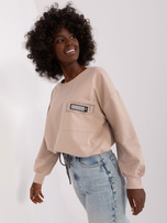 Hurt Beżowa krótka bluzka na co dzień ze ścigaczem