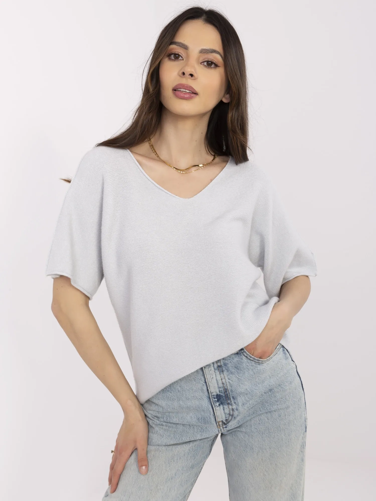 Light gray women's basic sweater with short sleeves.