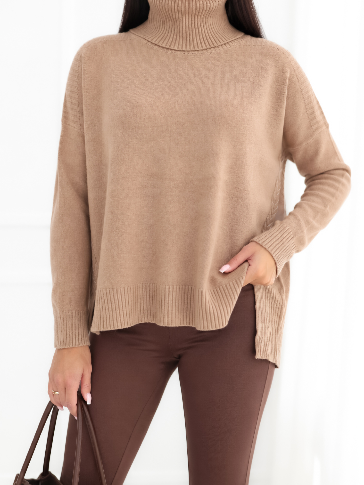 Dark beige oversized sweater with a longer back.