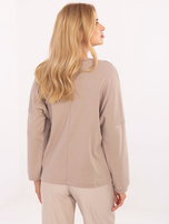 Dunkelbeige Baumwollbluse mit Aufschrift.