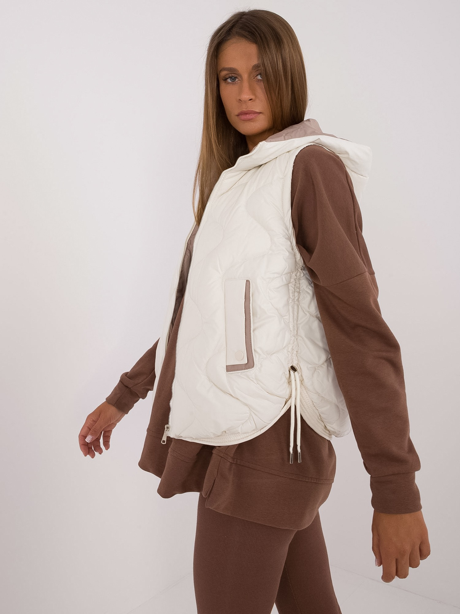Hurt Ecru down vest with pockets.