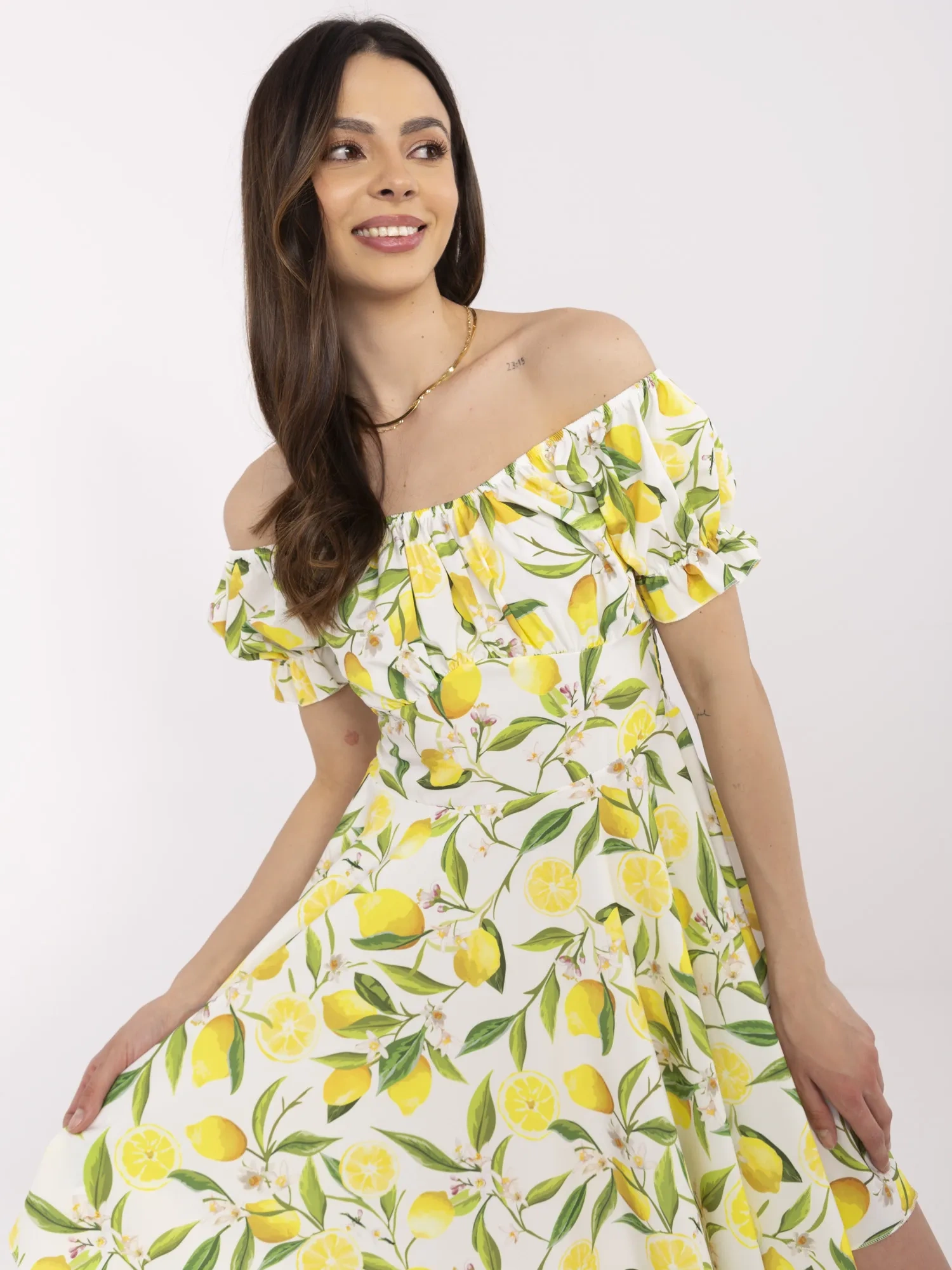 Ecru-yellow off-the-shoulder dress with lemons.