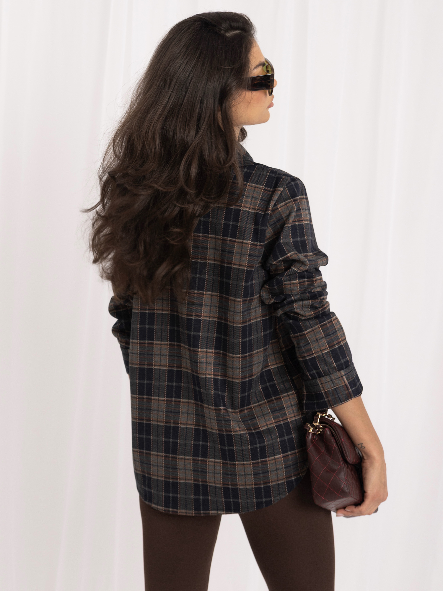 Navy flannel shirt with shiny studs.