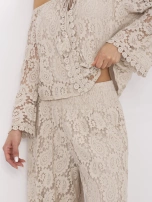 Beżowe szerokie spodnie z koronką 