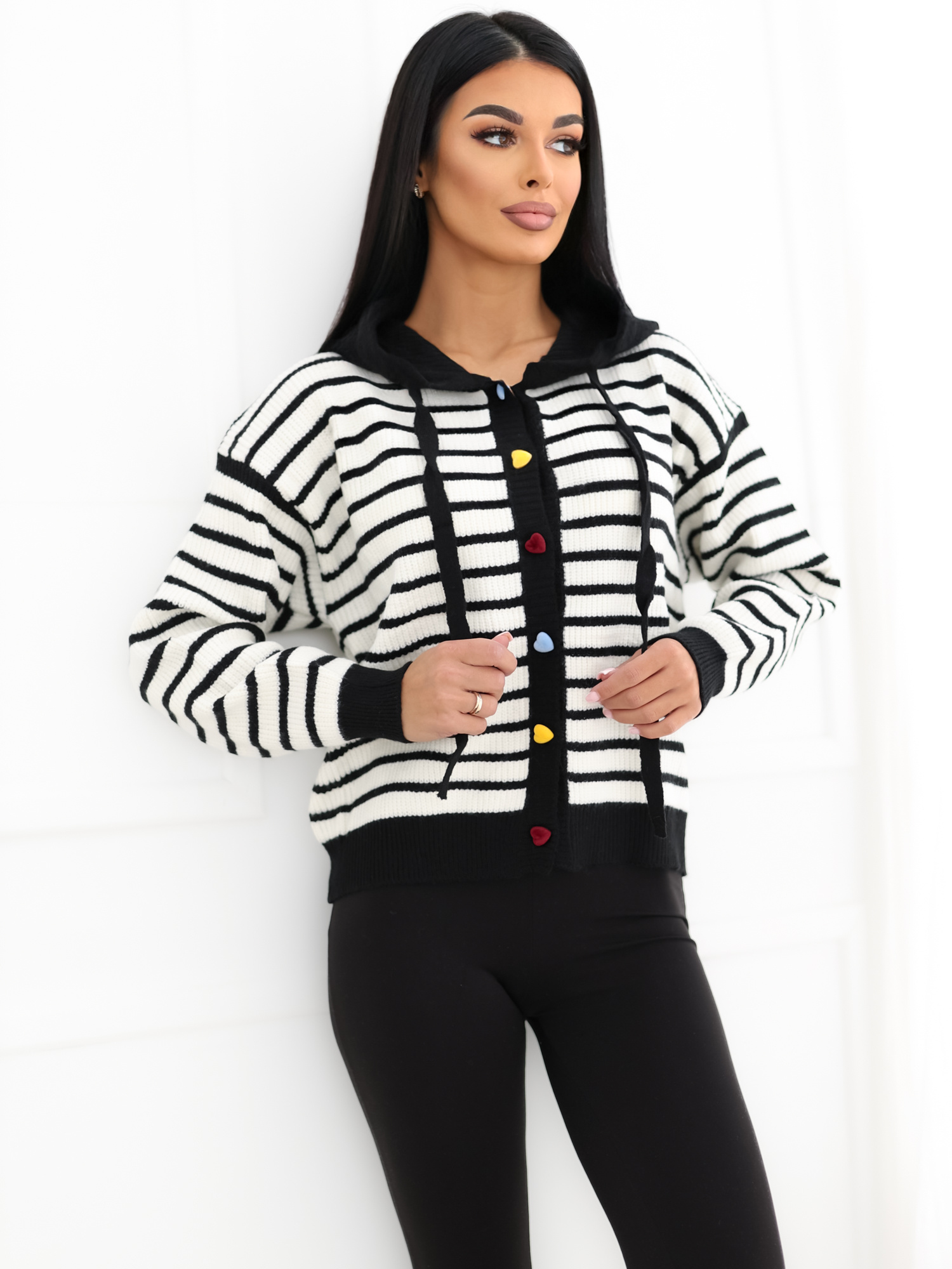 Black striped cardigan with colorful hearts.