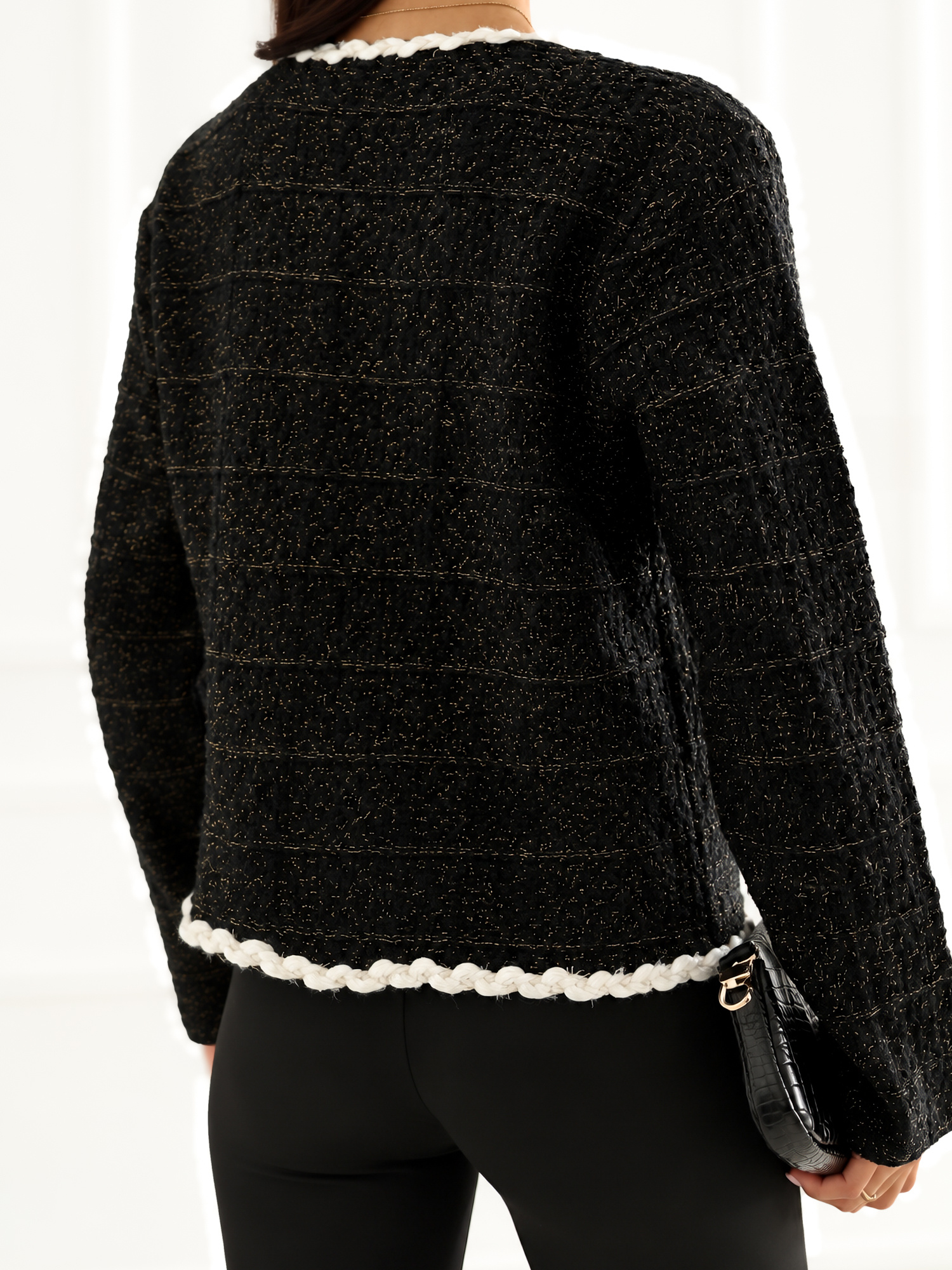 Black elegant cardigan with golden thread.