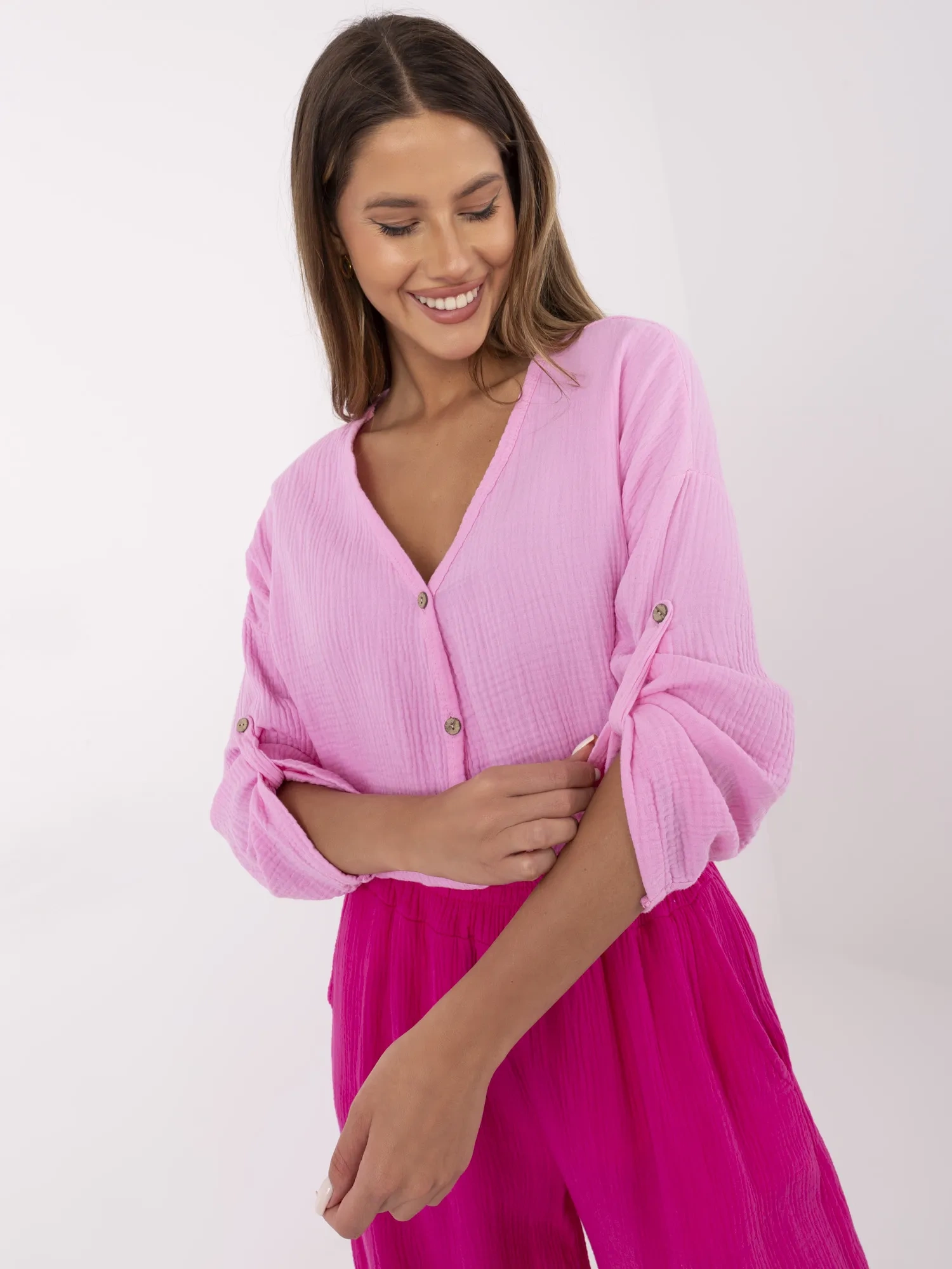 Pink muslin women's shirt with 3/4 sleeves.