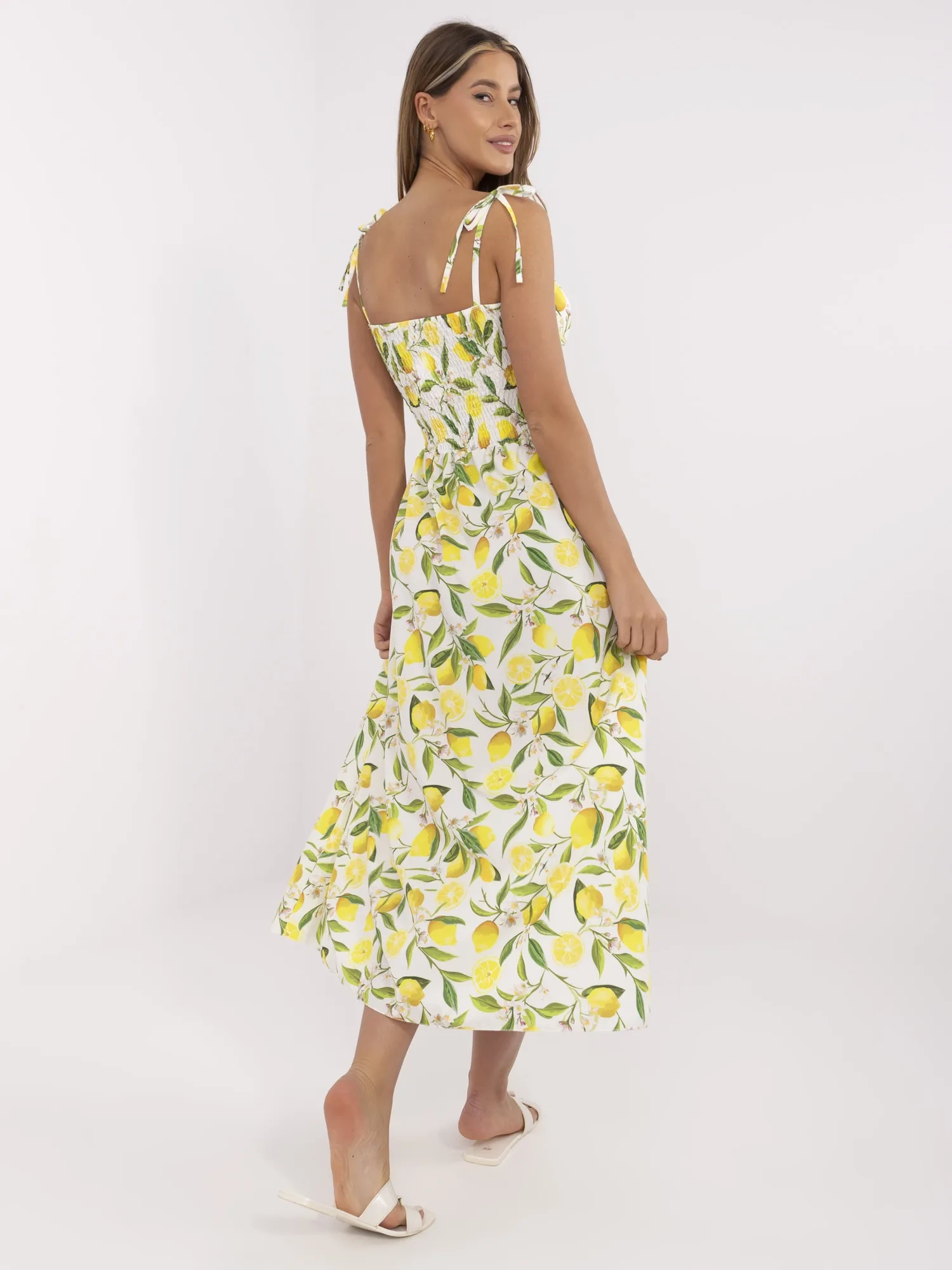 Ecru-yellow long dress with lemons.