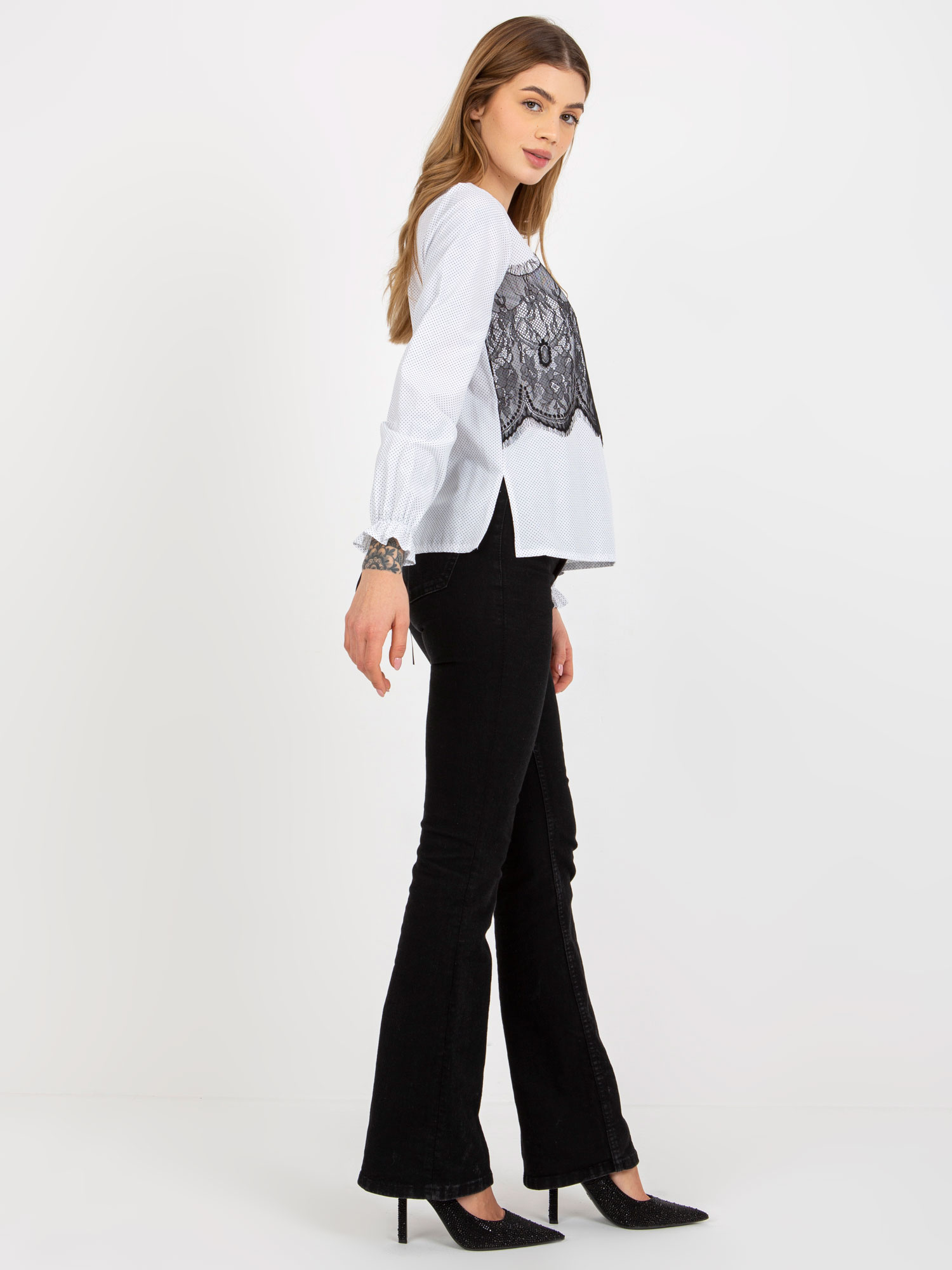 Hurt black and white polka dot blouse with a tie.
