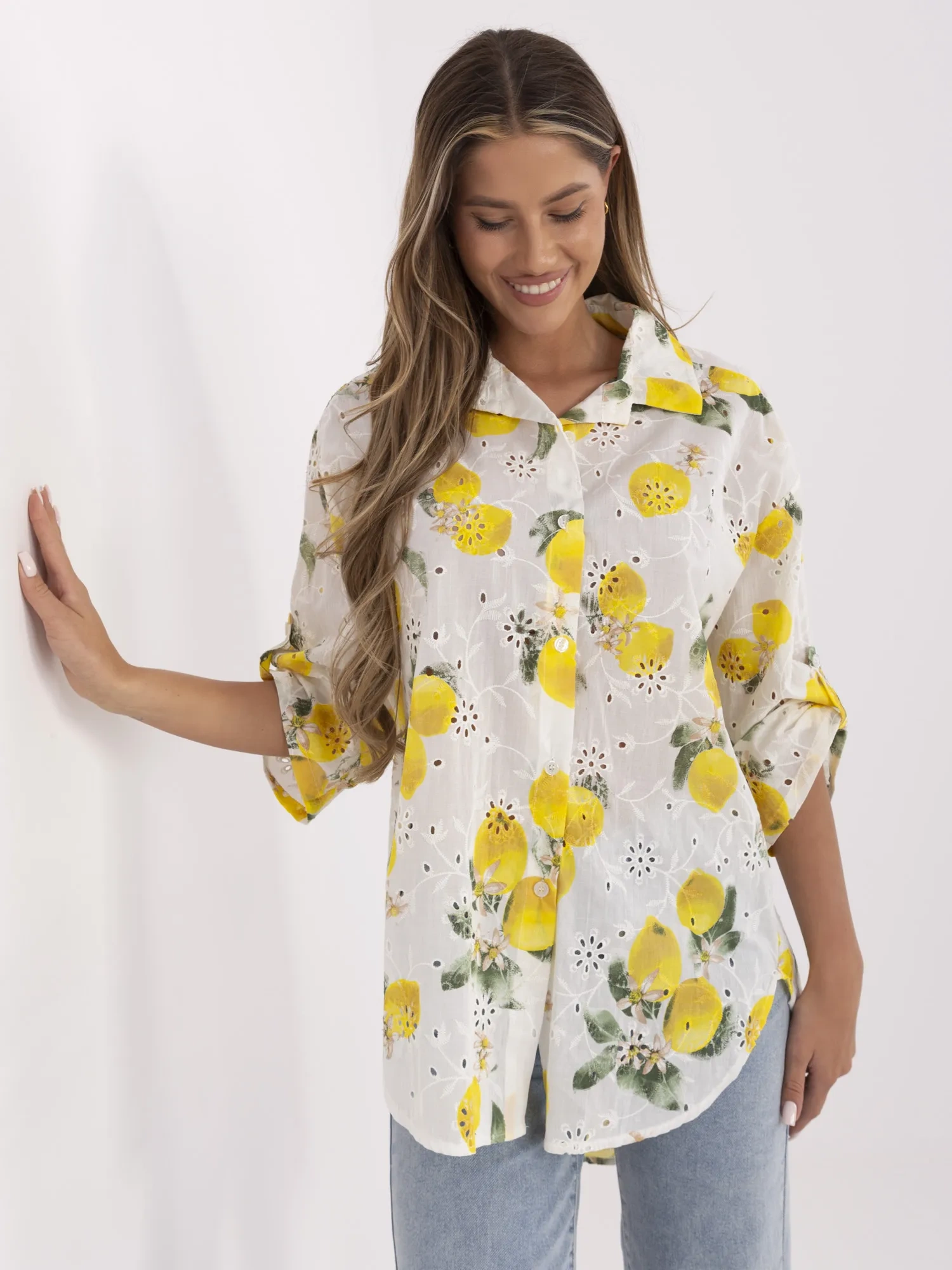 Ecru-yellow asymmetrical shirt with embroidery.