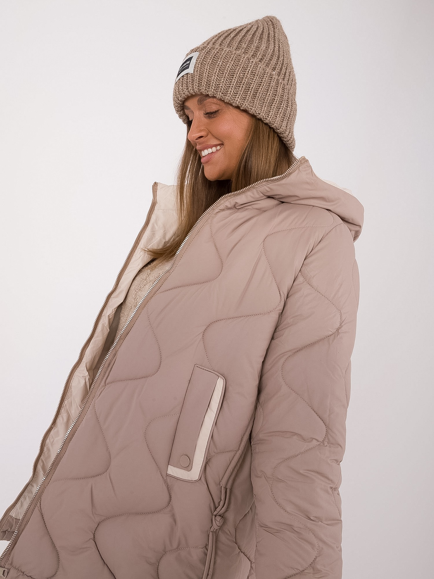 Hurt beige transitional jacket with pockets.