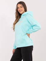 Miętowa dresowa bluza oversize z napisem RUE PARIS 